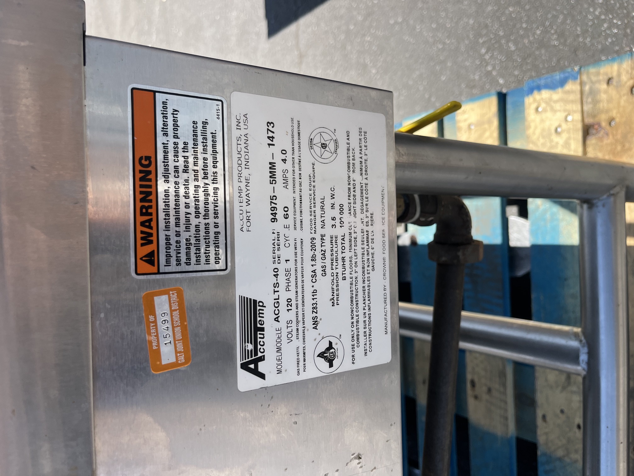 AccuTemp ACGLTS-40 data plate showing model number, serial number 94975-5MM-1473, 120V 1-phase 60Hz 4.0 amps, natural gas, 100,000 BTU/hr