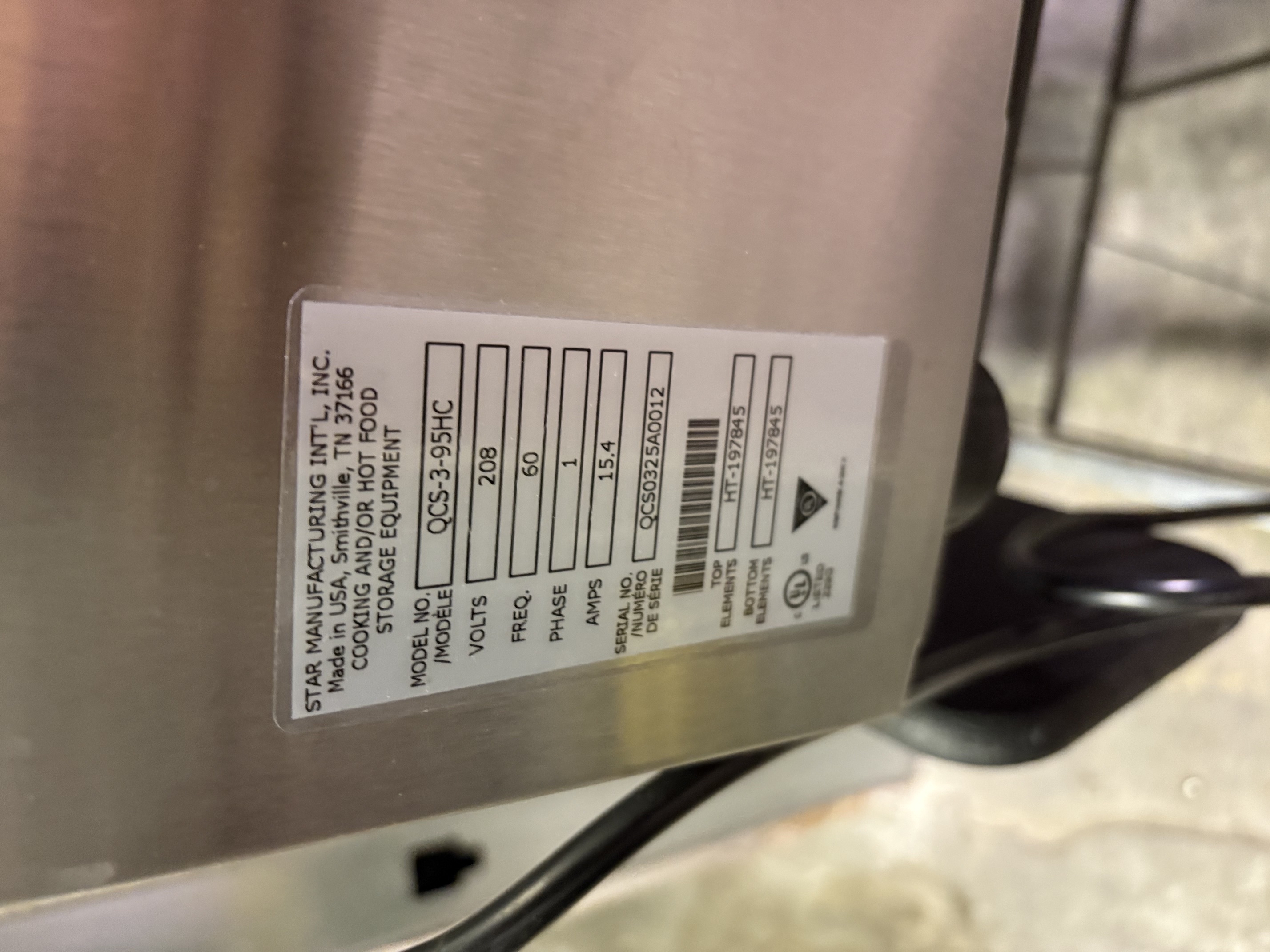 Star Manufacturing QCS-3-95HC data plate showing model, voltage, amperage, serial number, and element part numbers on stainless steel body