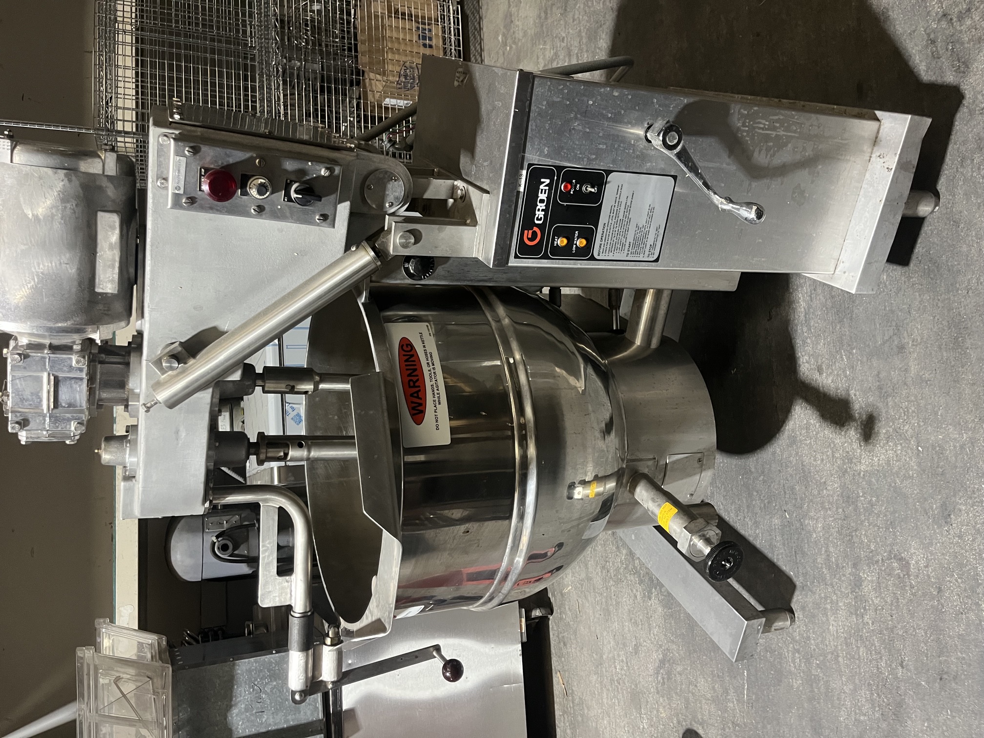 Groen DHT/1-40 40-gallon gas tilting steam jacketed kettle with built-in mixer, front view showing stainless bowl, agitator, and control panel