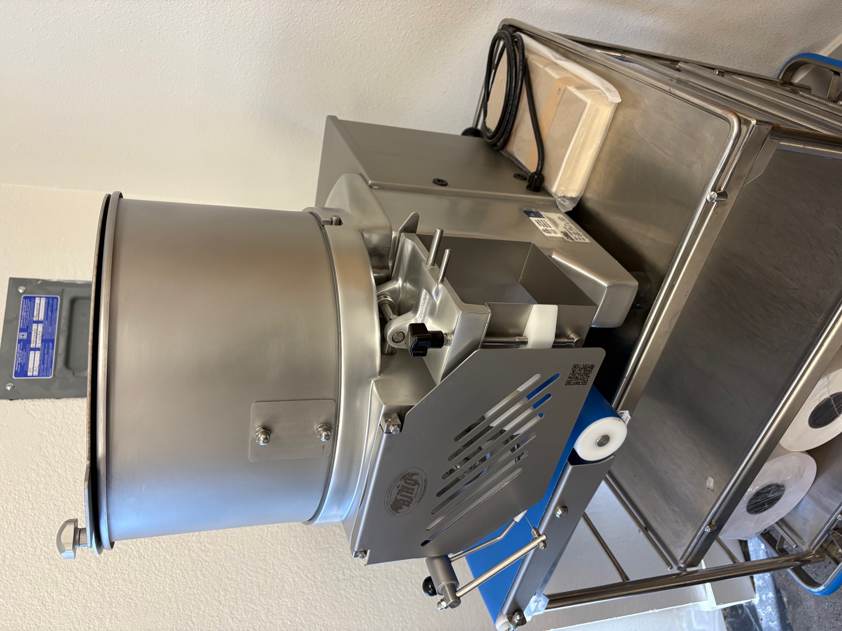 Rear angle view of Biro F2000PLUSB showing the back of the hopper, forming mechanism, and power cord