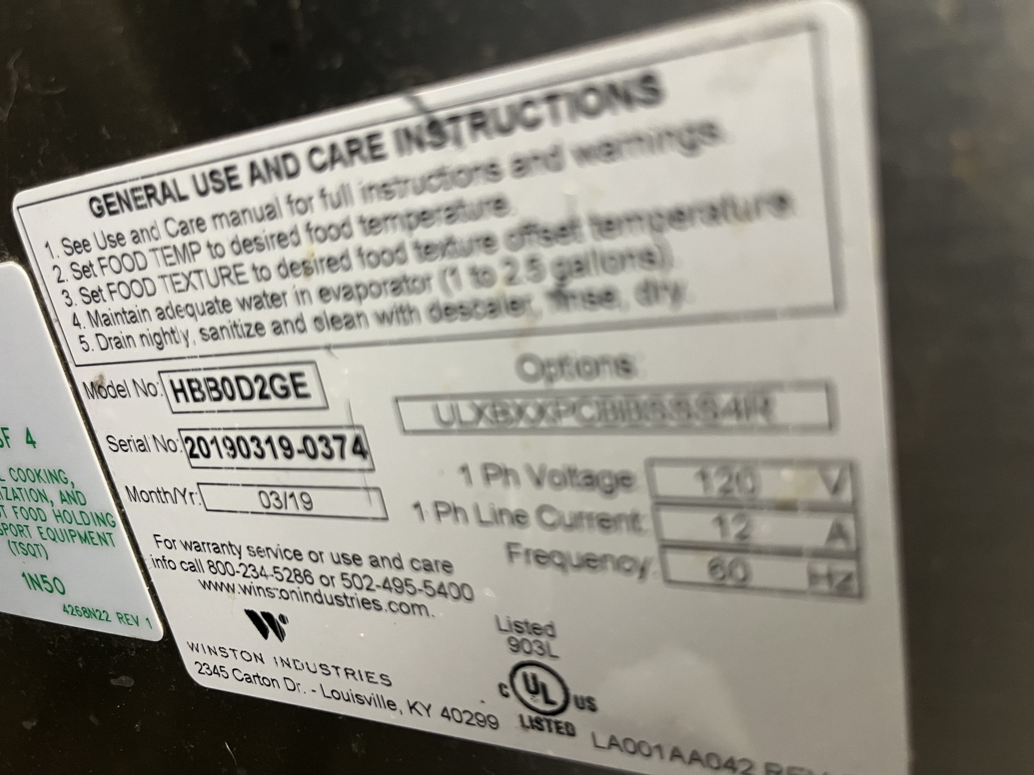 Close-up of Winston Industries data plate showing model HBBOD2GE, serial number 20190319-0374, manufactured 03/2019, 120V 12A 60Hz specifications