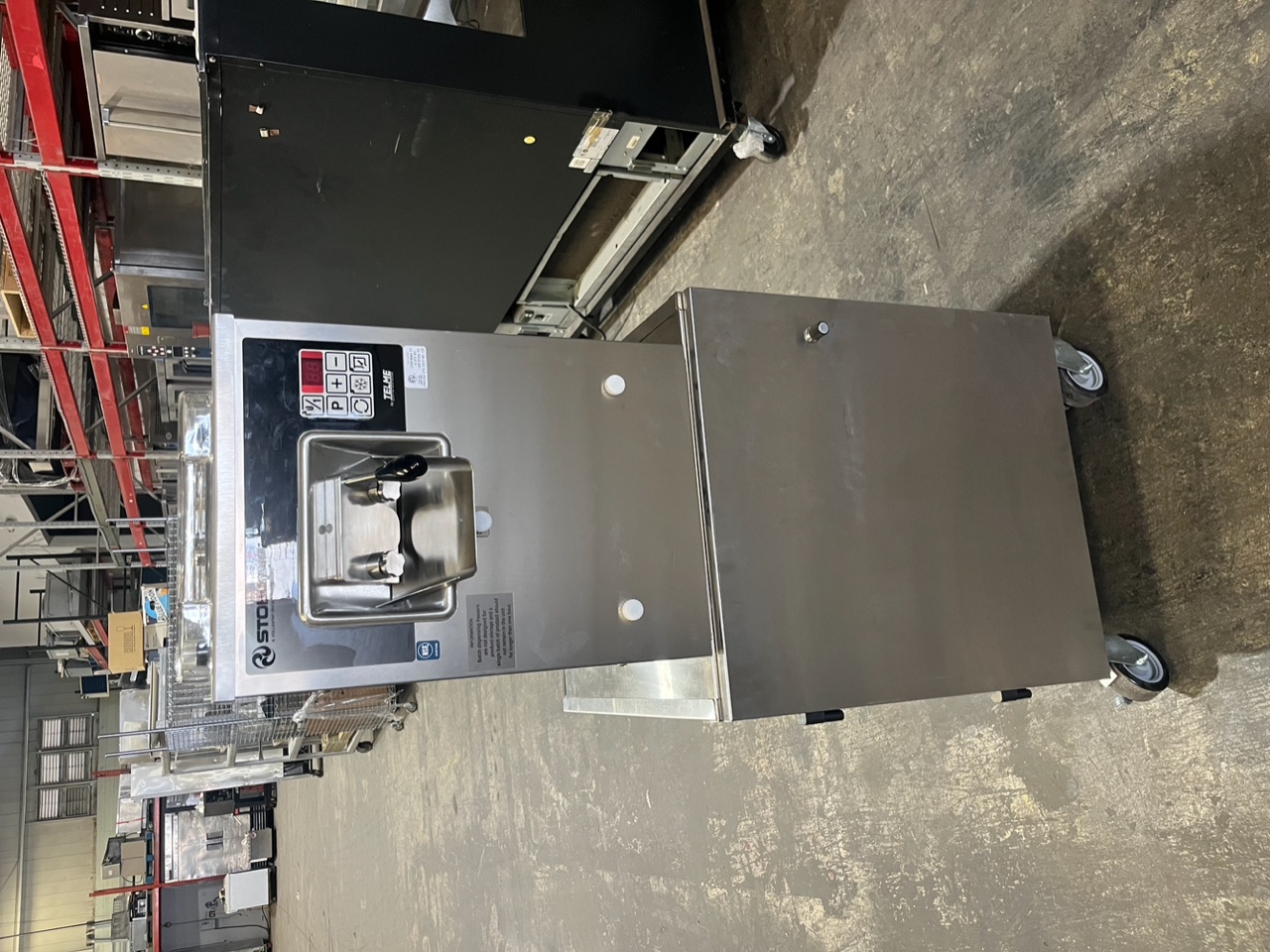 Front view of Stoelting VB9-37a batch freezer on casters showing dispensing spout and digital control panel
