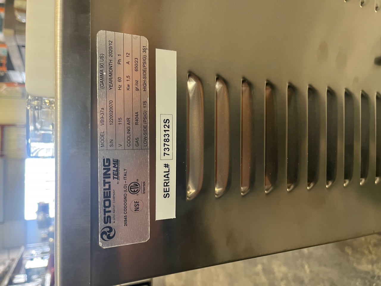 Close-up of Stoelting VB9-37a data plate showing model, serial number, voltage, and manufacturing date December 2020