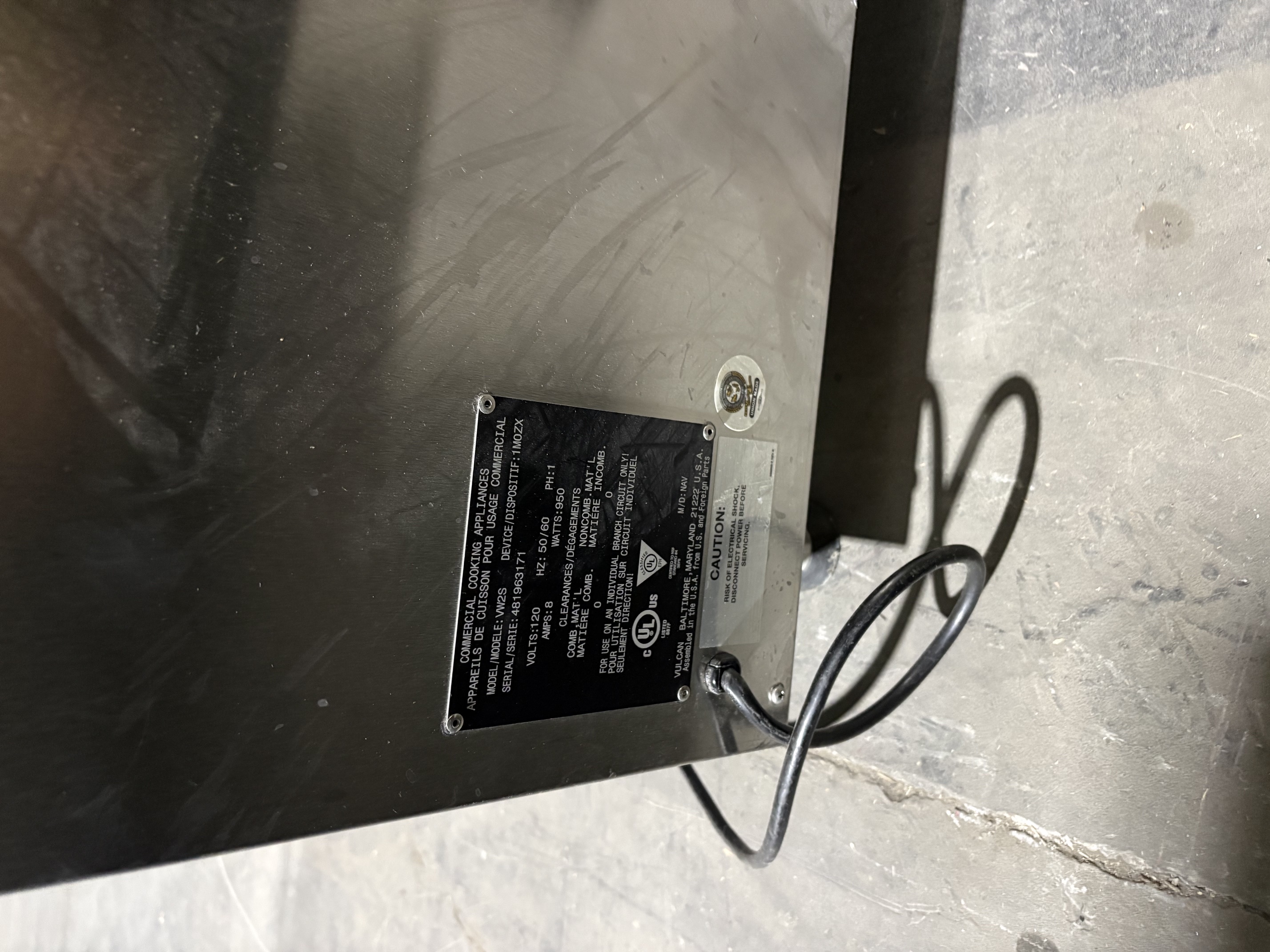 Vulcan VW2S data plate showing model number, serial number, and electrical specifications on rear of stainless steel unit