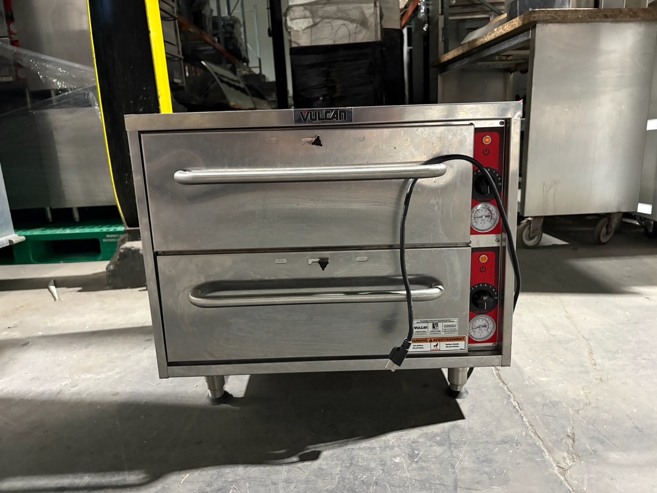 Front view of used Vulcan VW2S double-drawer countertop food warmer with stainless steel construction, two pull handles, and red control panels with temperature gauges