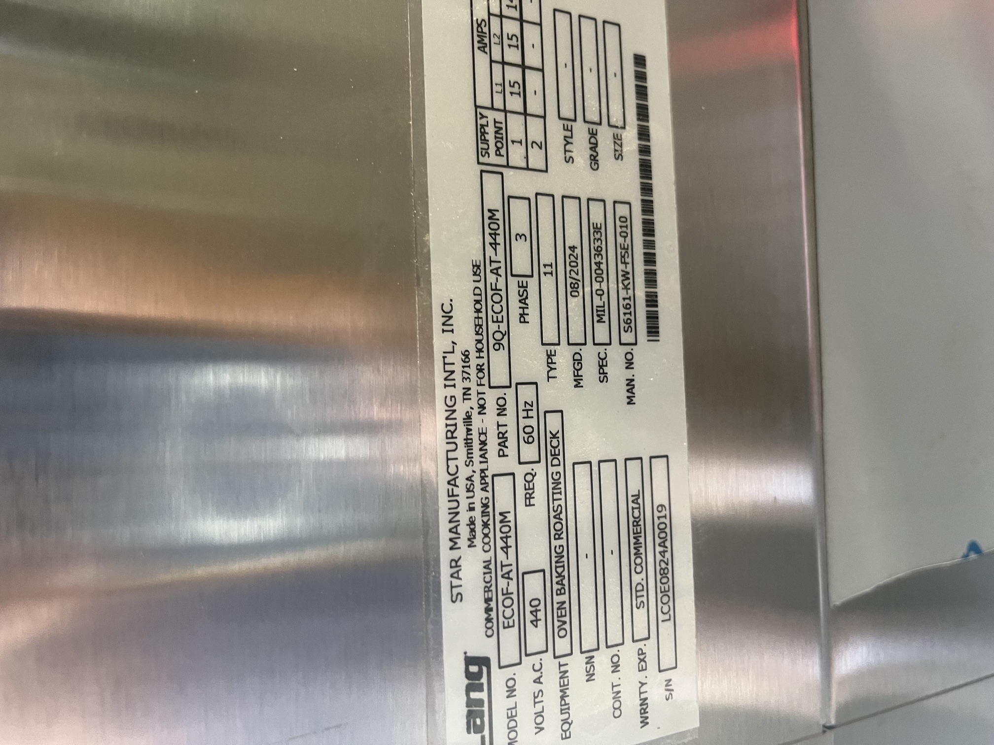 Data plate label on Lang ECOF-AT-440M showing model number, 440V 3-phase specs, manufacture date August 2024, and serial number