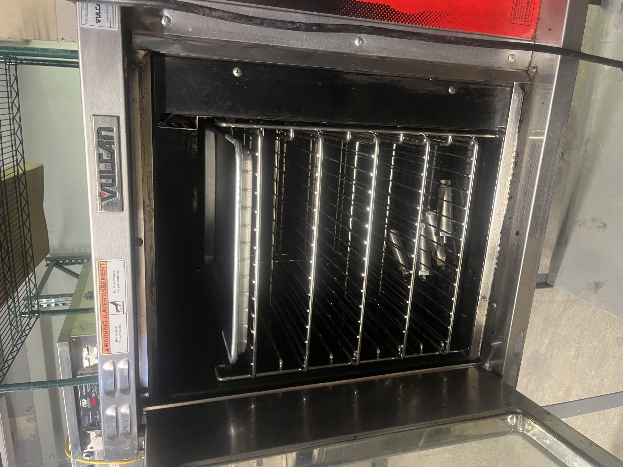 Vulcan GCO2D convection oven with glass door open showing five wire rack positions and a sheet pan inside the stainless steel interior