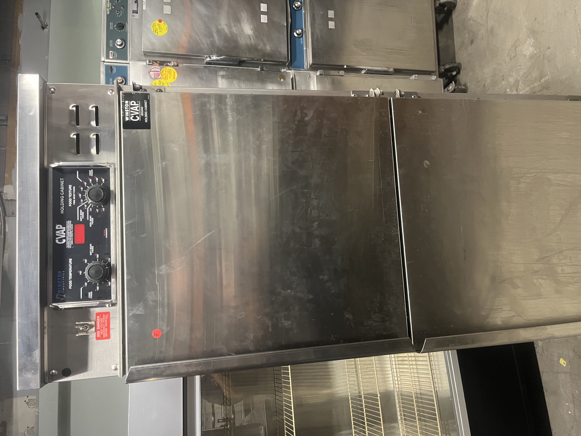 Front view of Winston CVAP dual-door stainless steel holding cabinet with doors closed, showing control panel with Food Temperature and Food Texture dials