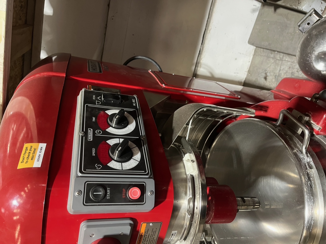 Close-up of Hobart HL662 control panel showing speed dial, timer dial, bowl lift switch, and start/stop buttons