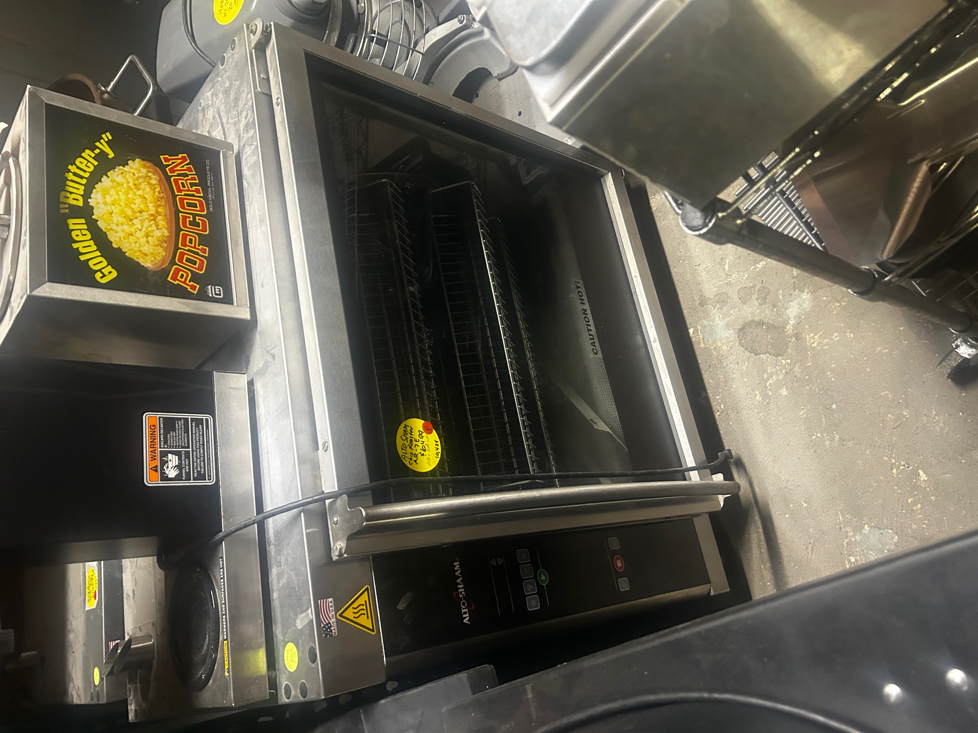 Alto-Shaam AR-7E electric rotisserie oven front view showing glass door, stainless steel body, digital controls, and interior wire racks