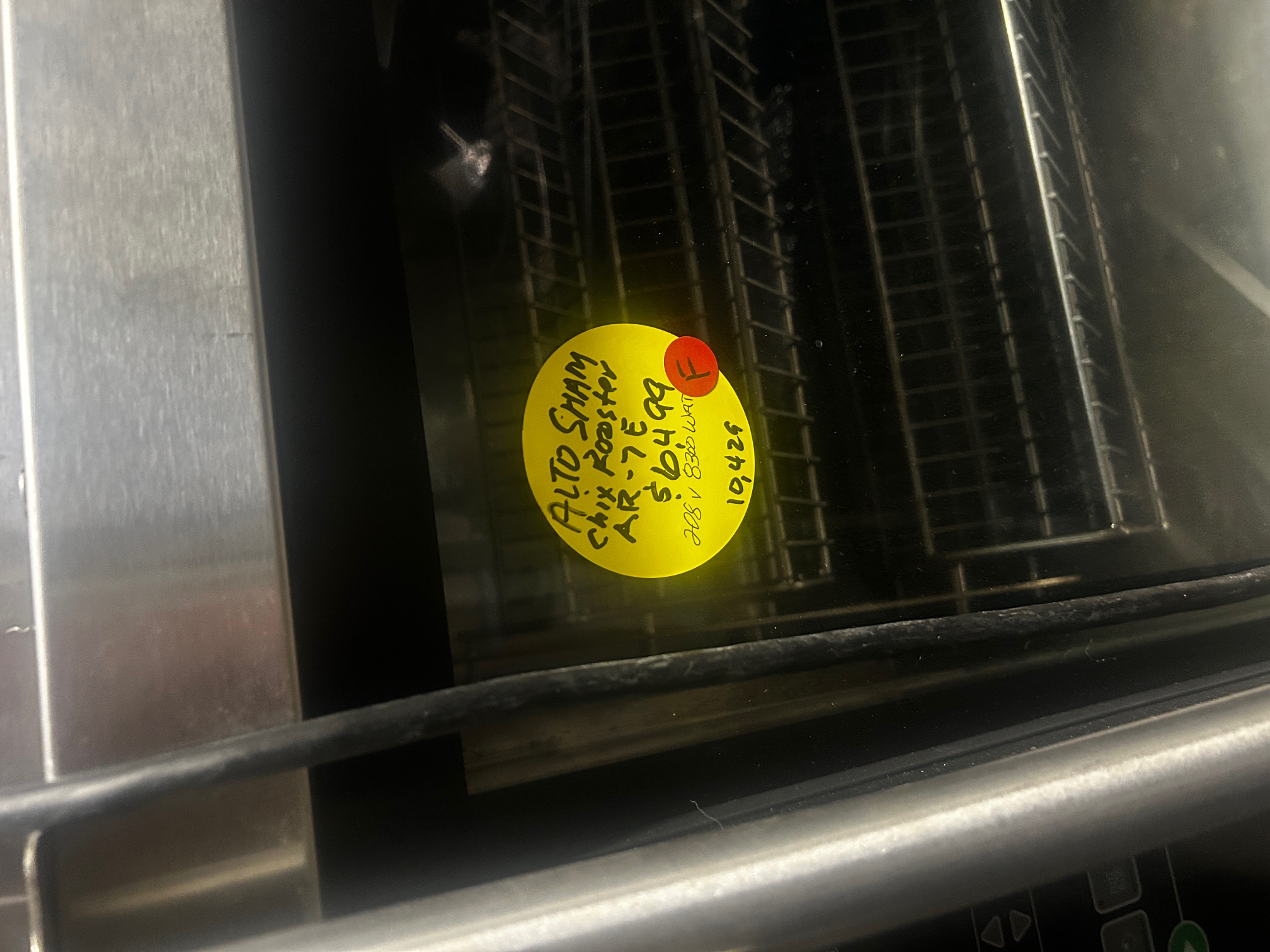 Close-up of yellow price sticker on Alto-Shaam AR-7E reading 'Alto Shaam Chix Roaster AR-7E $6499 208V 8300 Watt'