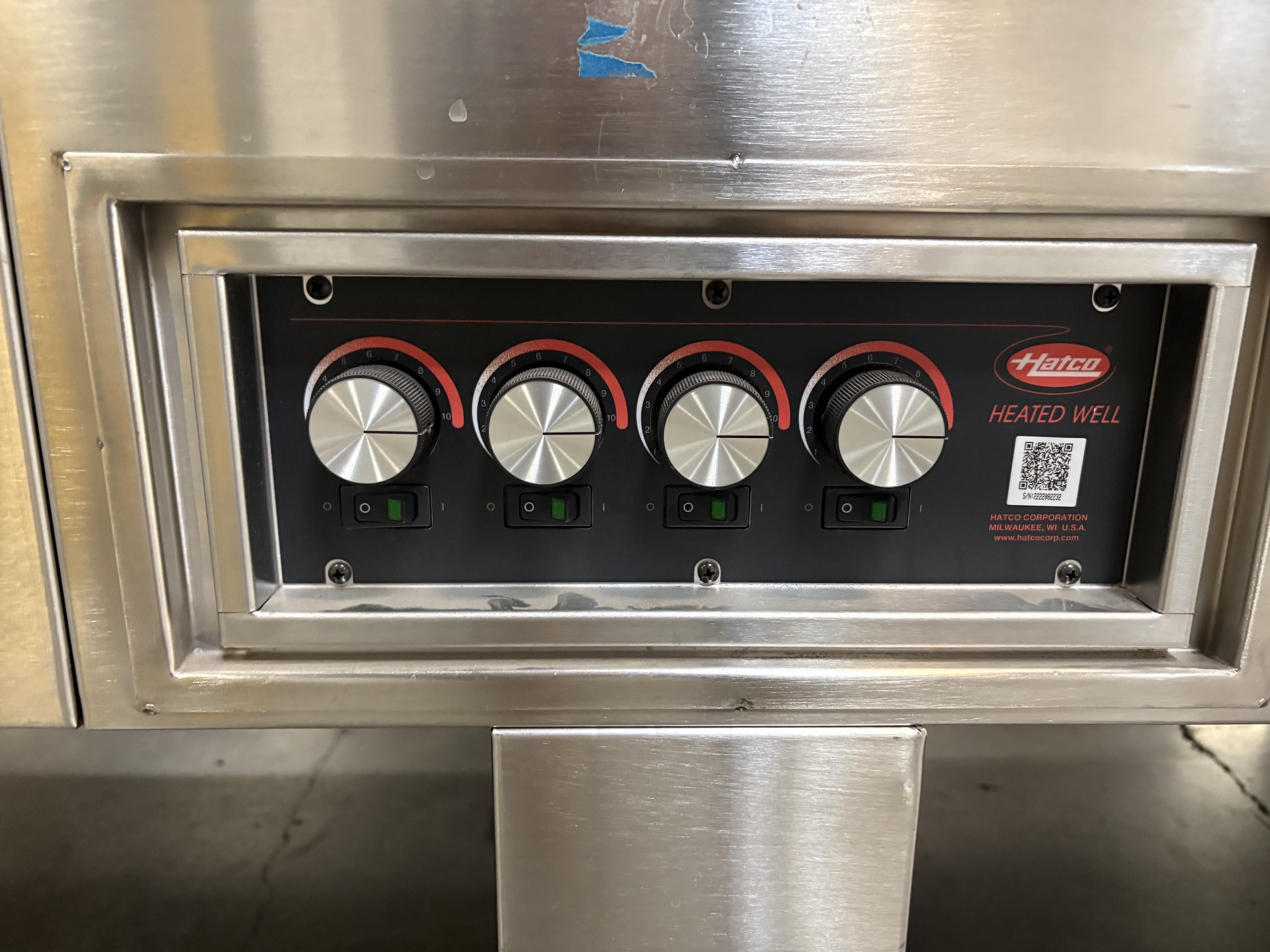 Close-up of Hatco Heated Well control panel with four individual temperature dials and on/off switches