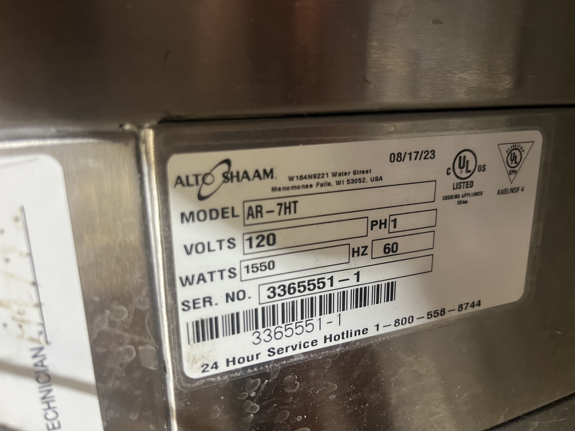 Data plate showing Alto-Shaam AR-7HT model number, 120V, 1550W, serial 3365551-1, manufactured 08/17/2023
